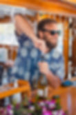 Bartender getting ready to open wine bottle for friday night sunset dinner cruise