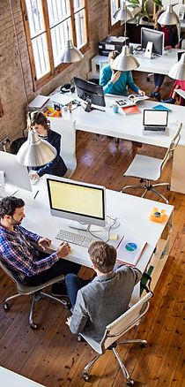 photo of an office with two male working