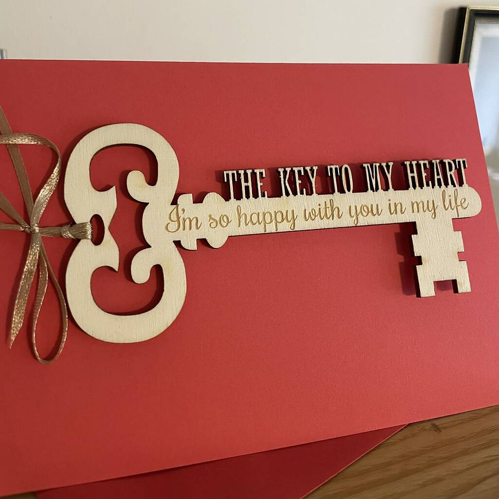 Thumbnail: engraved message on wooden key attached to a red card