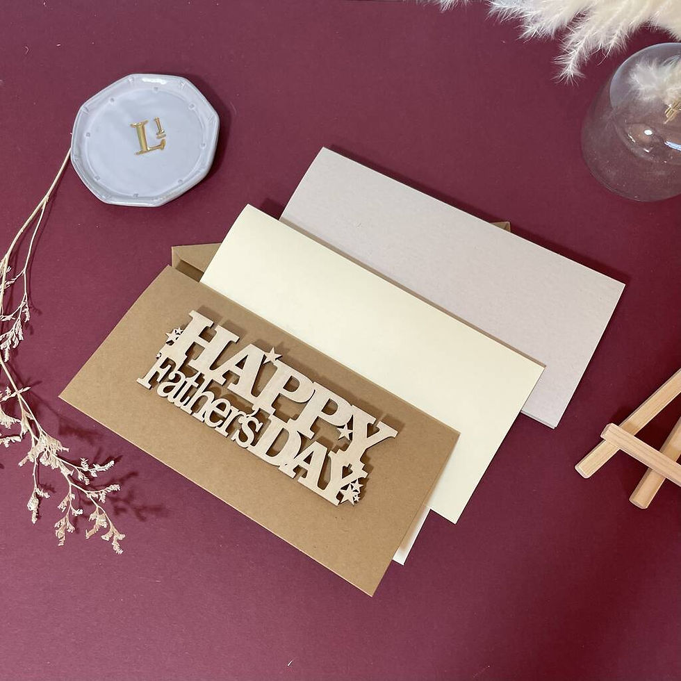 Thumbnail: wooden Happy father's day cut for wood and attached to a brown craft card with dried flowers and displayed on an easel