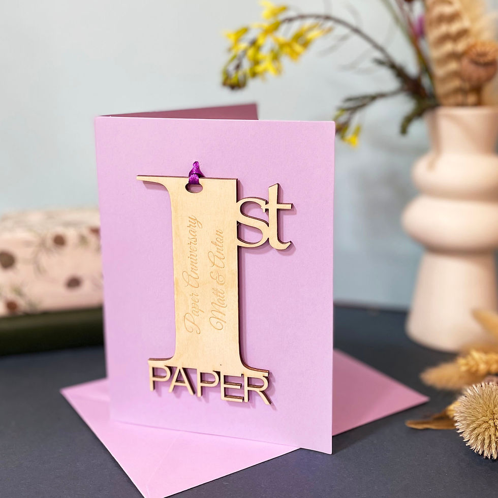 Personalised engraved wooden lasercut number 1 with name's running down the center on a lilac card.