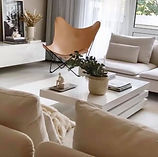 A neutral palette with scandinavian designs furnishing and iconic midcentury leather chair