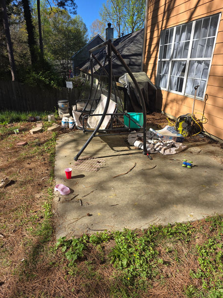 Swing Chair in the backyard of clients home ready to be hauled away