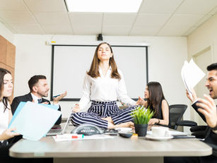 Woman meditating during a business conference
