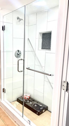 chromed frameless shower door.jpeg