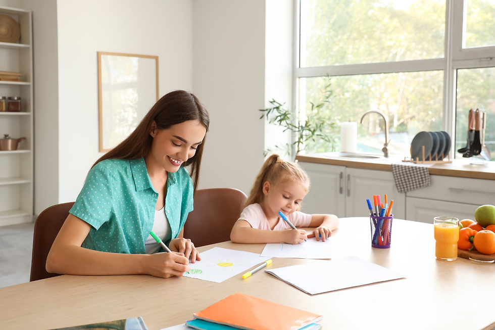 Nanny sat on a table helping child with learning