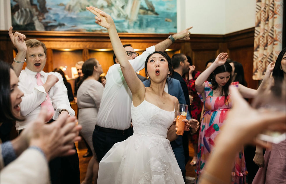 Eye-level view of a DJ setup with colorful lights in a hotel ballroom