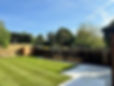 Landscaped back garden with wooden flower beds