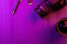 vecteezy_camera-pencil-fish-eye-lens-and-sd-card-pink-light_3937054.jpg