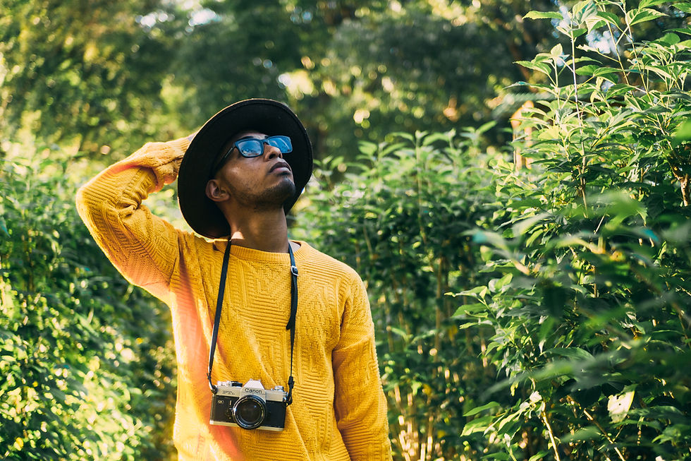 vecteezy_young-latin-american-man-in-a-forest-wears-a-yellow-sweater_52257601.JPG