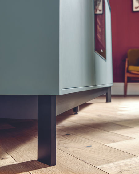 Close-up of Next125 luxury German kitchen island's black aluminium legs.