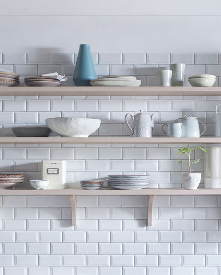 Schuller kitchen shelves with kitchenware and white subway tiles 