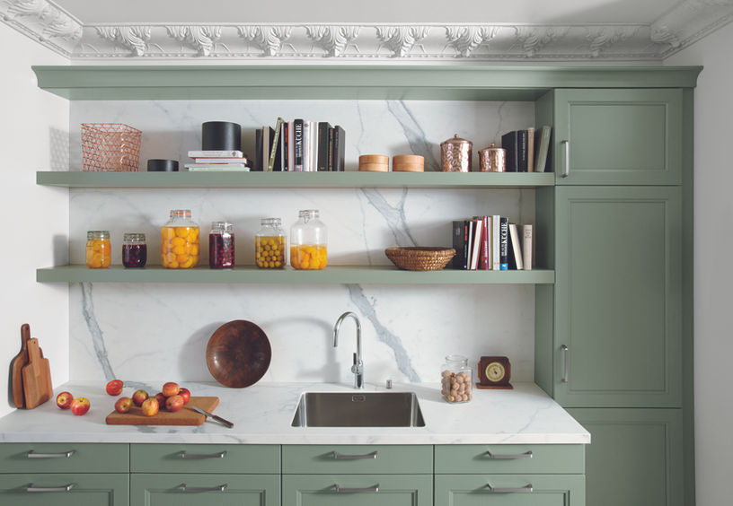 Sage green Schuller shaker kitchen with white marble worktop

