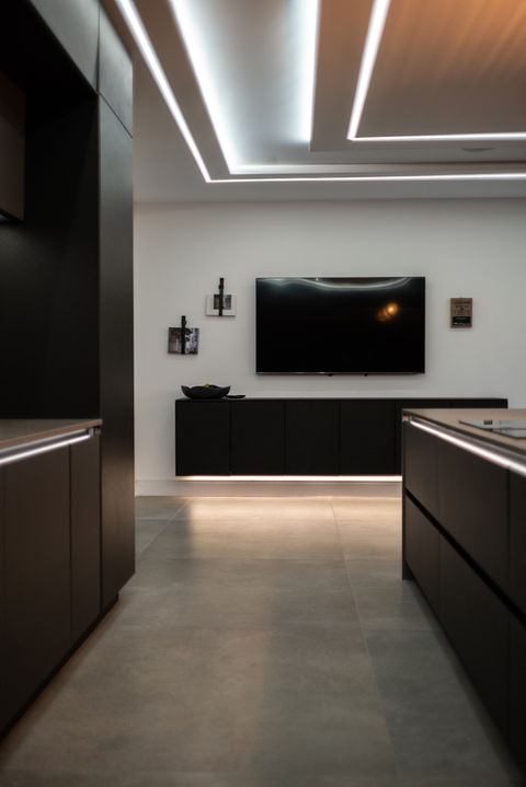 Wall hung cabinet matching next125 kitchen, below TV in Wynyard, designed by Scott Marks.
