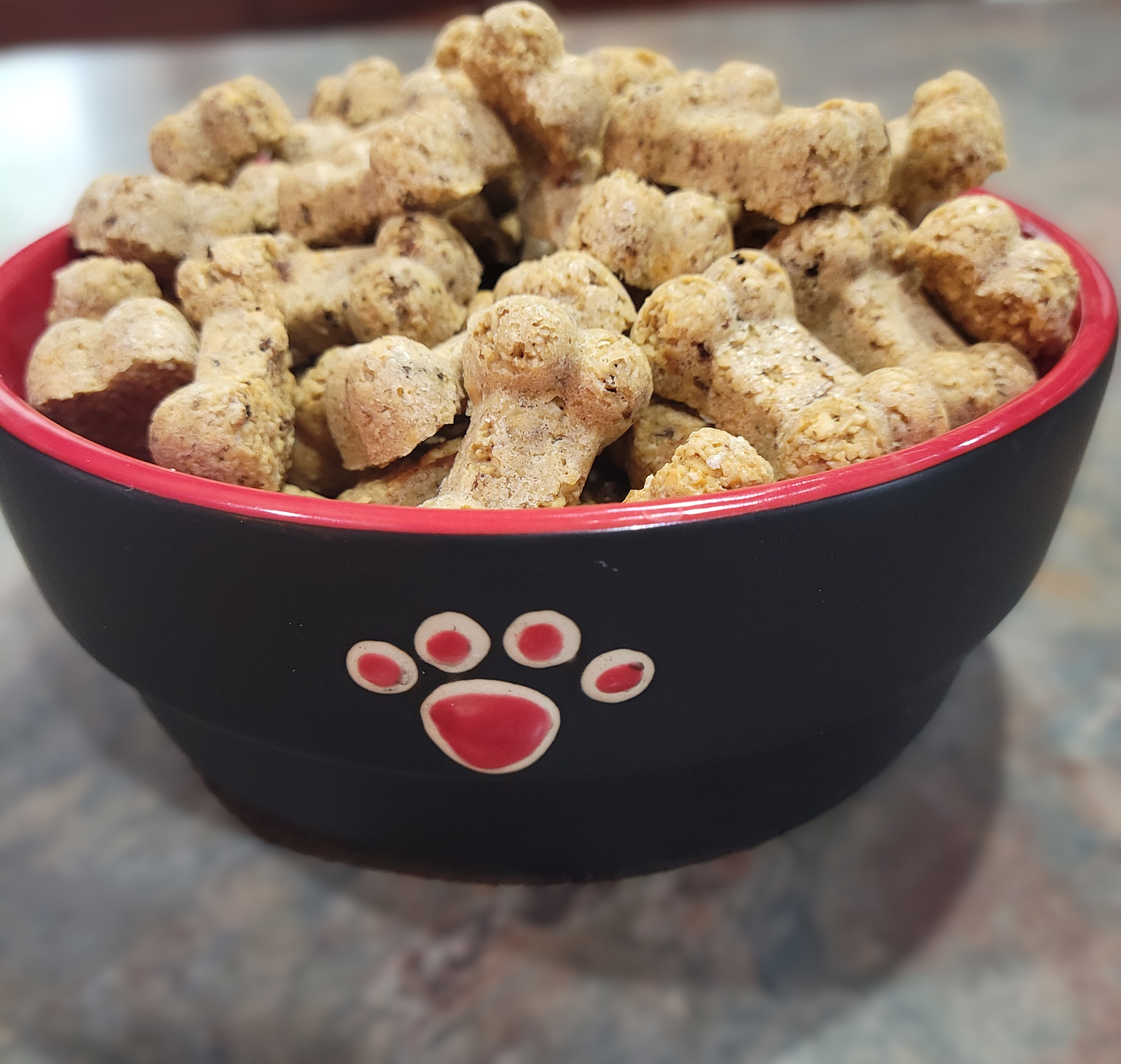 An image of Beggin' for Bacon Dog Treats, showcasing a bowl of dog treats made with oats, bacon, and cheddar cheese.