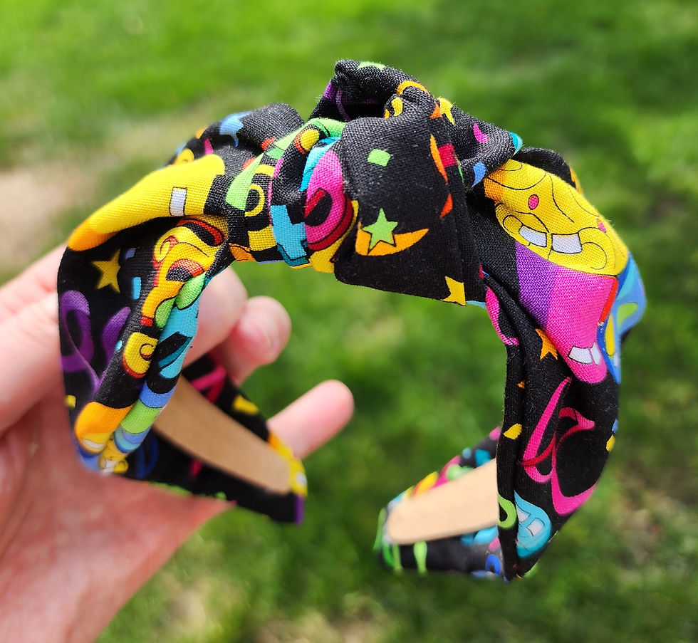 Colorful birthday print knotted headband with festive design