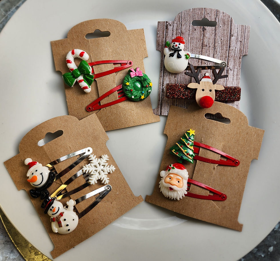 Four retro Christmas hair clip sets on kraft paper cards featuring handmade Santa, reindeer, wreath, snowman, and Christmas t