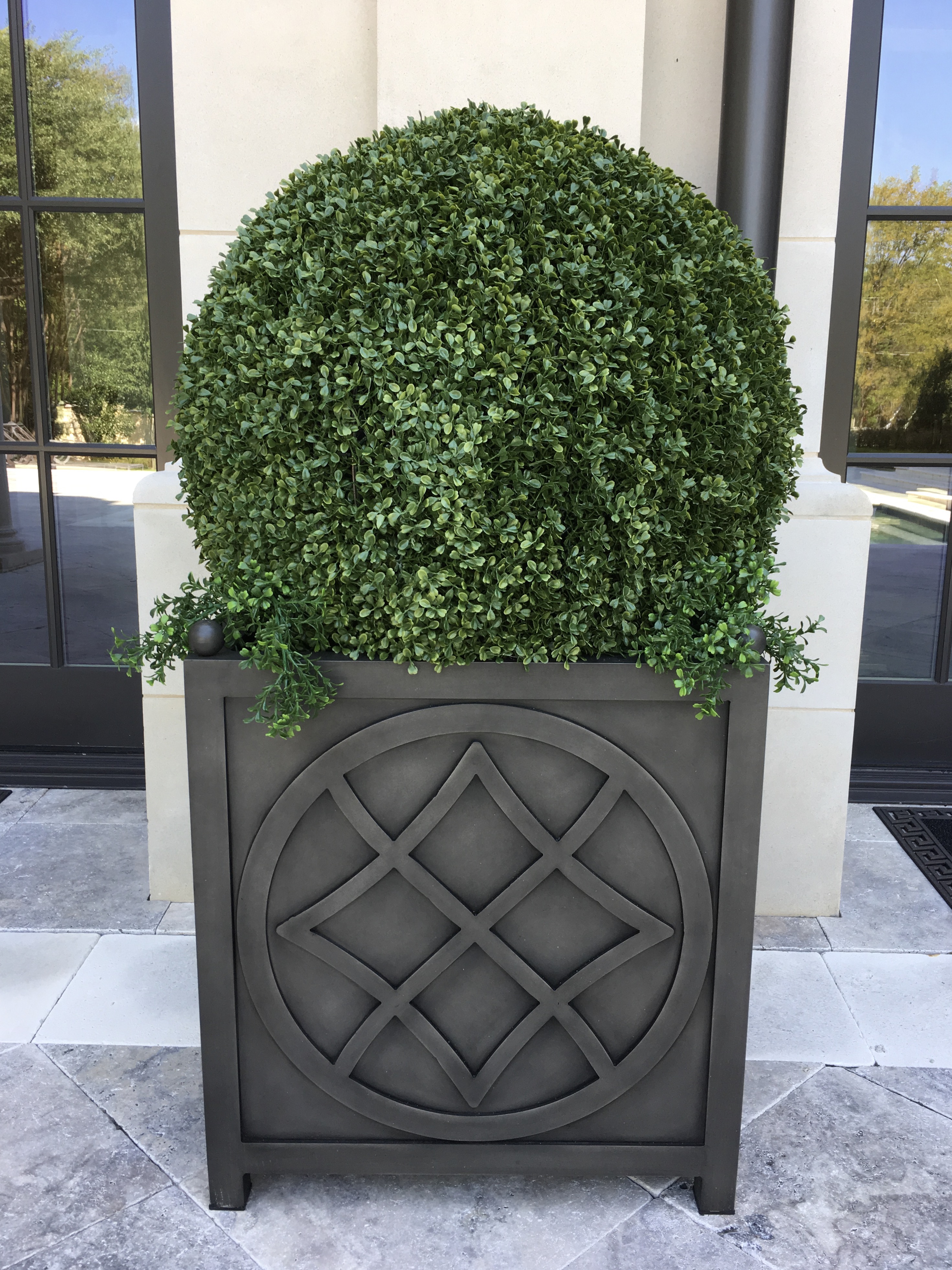 Large Boxwood Balls line the Patio i