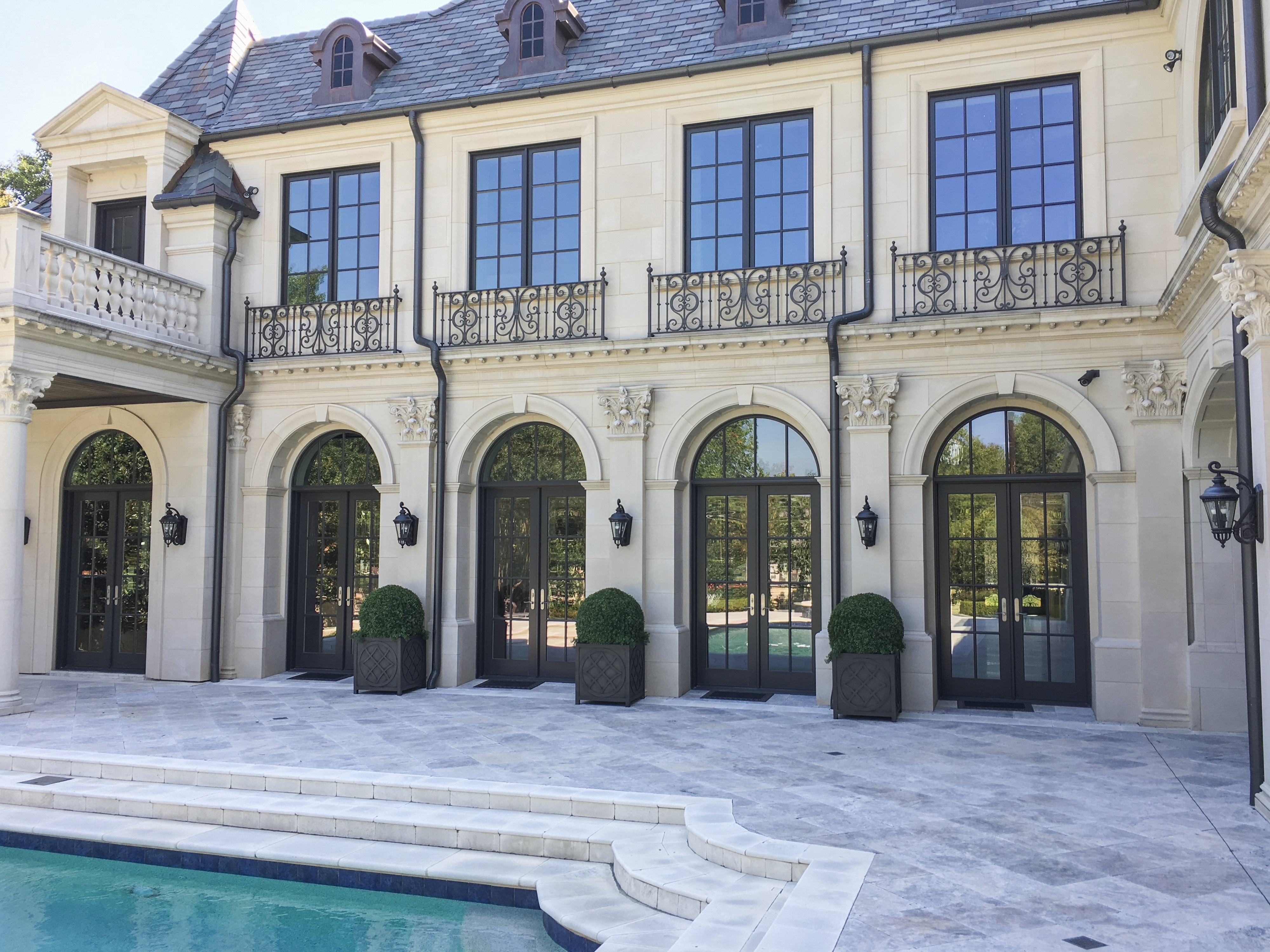 Large Boxwood Balls line the Patio i