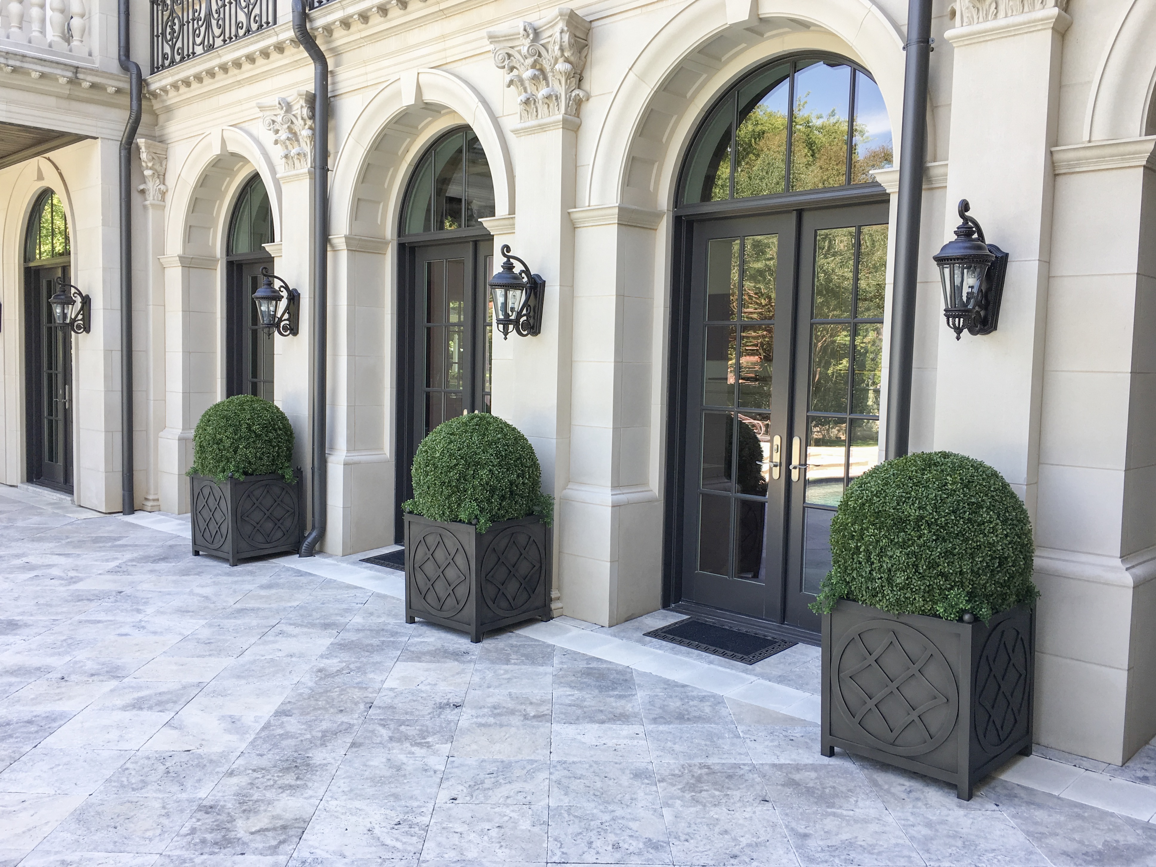 Large Boxwood Balls line the Patio i