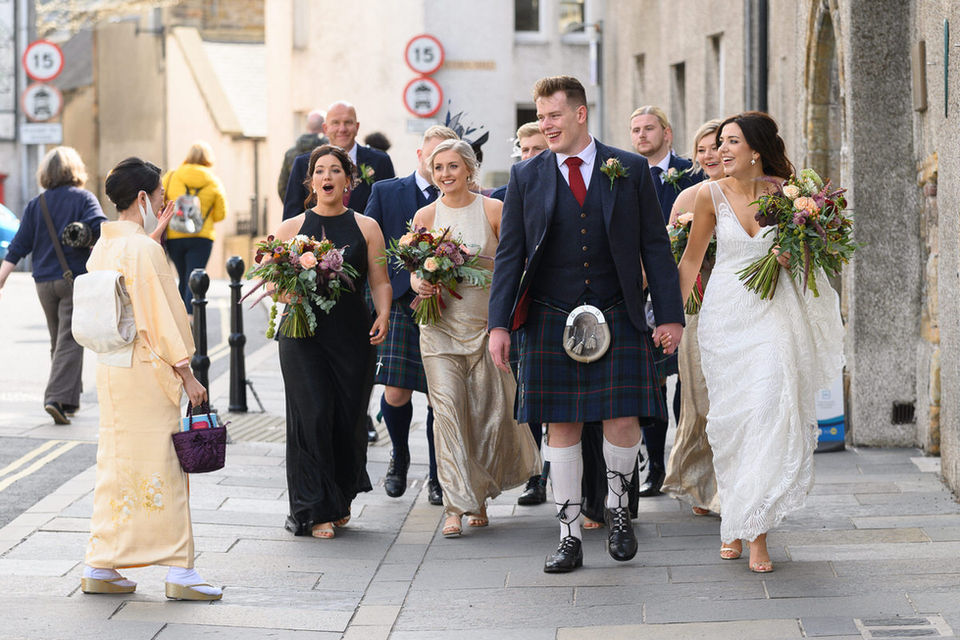 bridal party meet a woman in traditional Japanese dress in the street, Kirkwall Orkney