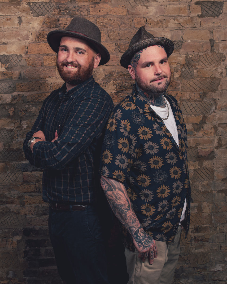 Studio portrait of two brothers wearing patterned shirts, Kent family photographer