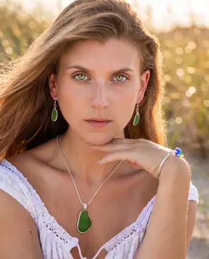 Model wearing jewelry in the sunshine