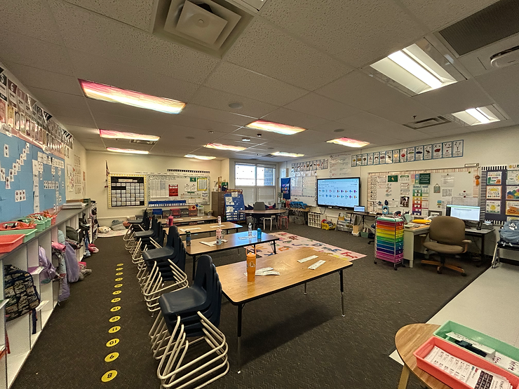 Here is the view of the classroom when you first walk inside. The students spend most of the time on the carpet or at their tables.