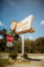 Vintage road sign for Orange Shop photographed by sidbrooke-balentine-CYck2cdtLhs-unsplash.jpg