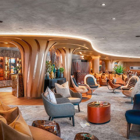 Elegant luxury interior with modern design elements, sophisticated seating, and organic architectural features, designed by Leli Construction in Los Angeles