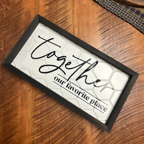 wall art on a rustic solid wood dining table