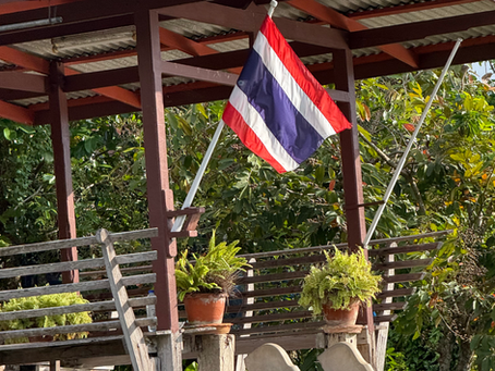 Thai flag hanging from floating house