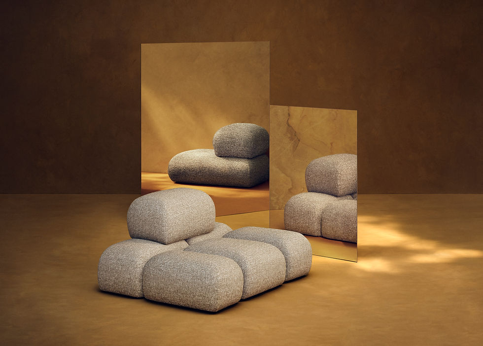 Gestoffeerde loungefauteuil met ronde, wolkachtige volumes in een lichte ruimte