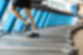 Person running on treadmill at Campus Fitness