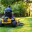 Thumbnail: hustler raptor xdx mower man riding in grass rear view
