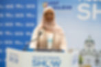 Hafsa Gaher giving a keynote speech at the Muslim Travel Show (Photo Credit: MTS)