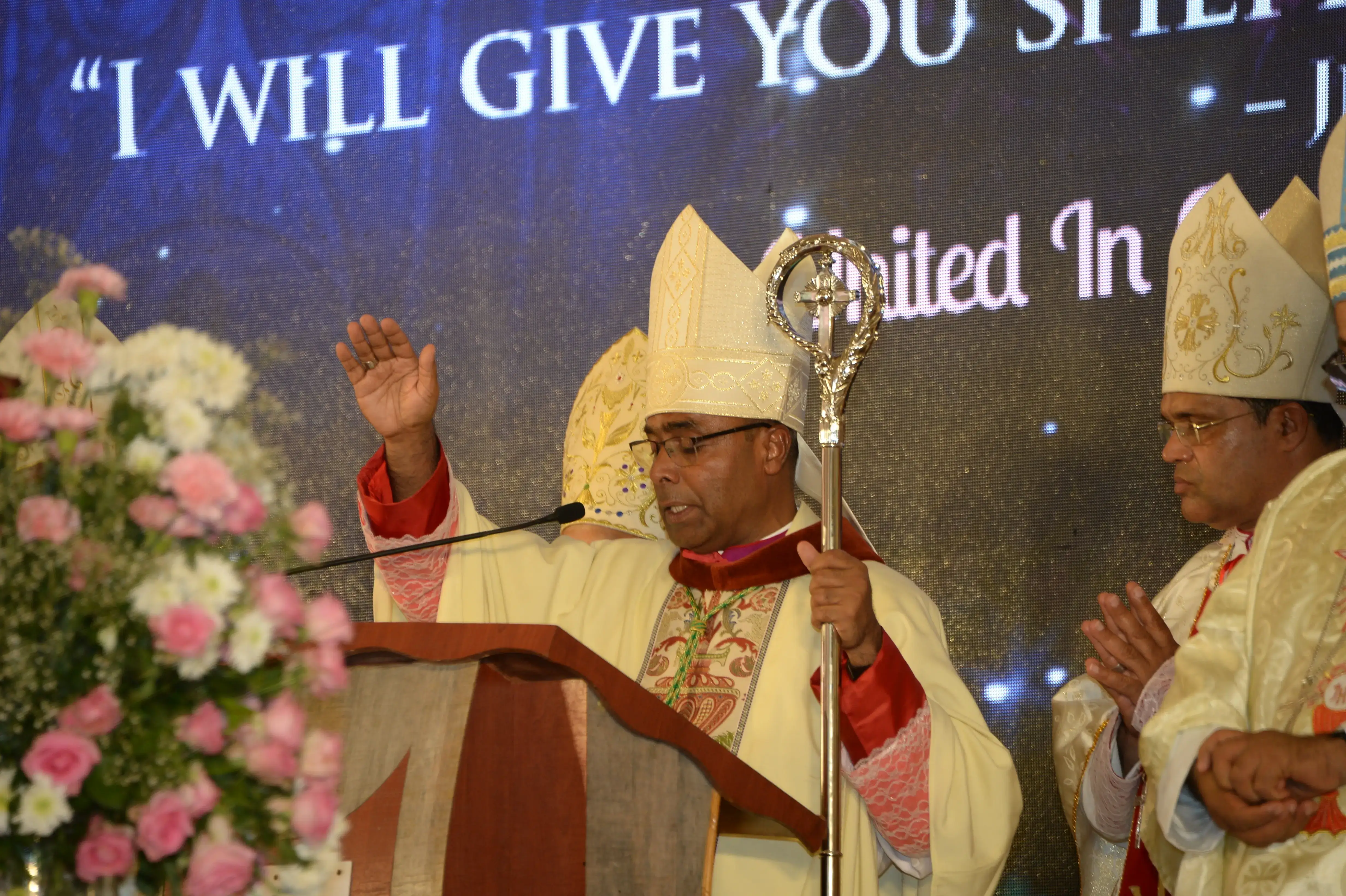 Bishop John Carvalho blesses people