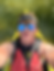 Young man in sunglasses kayaking
