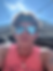 Young man in sunglasses and bandana outdoors