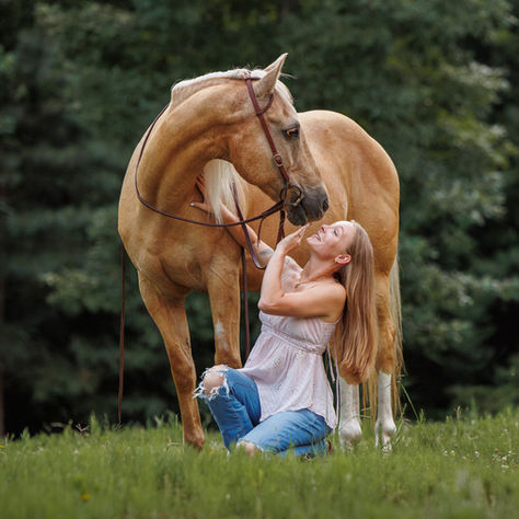 Woman poses with her palomino horse near Athens, Georgia