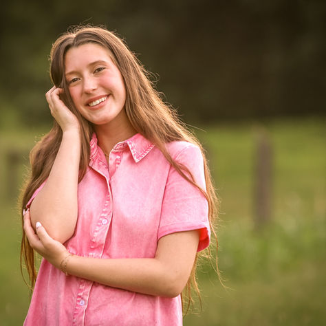 senior girl poses for a senior portrait outside of Atlanta, GA taken by K. Williams Photography
