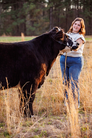 FFA livestock photography as a senior student poses with her cattle