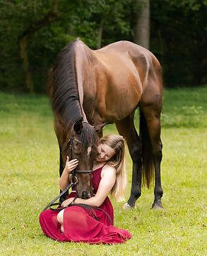 Horse and Rider Portrait, a girl in a red dress sits next to a horse