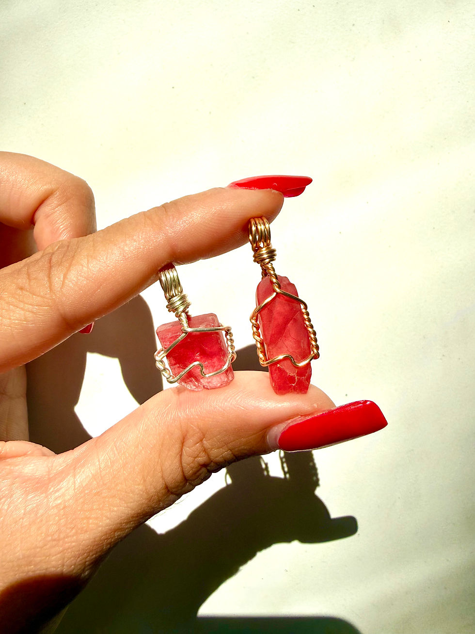 Thumbnail: Raw Rhodonite Pendants
