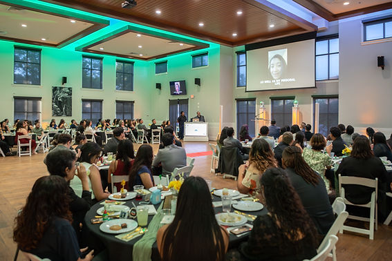 2025 Fellowship Award Dinner; Wide Shot; Fellow's slide presentation (context- Fellows wer