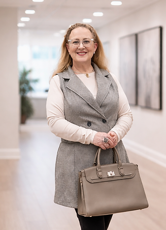 Stylish woman with Hermès Birkin bag.png