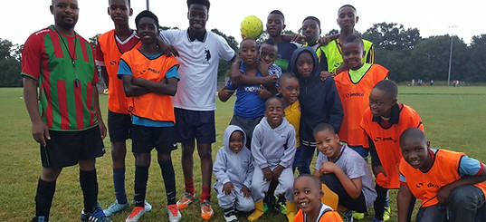 A team of young people after having played football.
