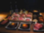 Premium course at Yakiniku Maumu, Kyoto. Assorted Wagyu beef cuts served with yukhoe, chilled noodles, bibimbap, namul, kimchi, and seasonal side dishes.