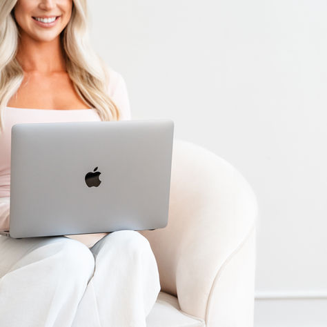 Therapist sitting in her office with laptop doing online therapy in Ottawa Ontario