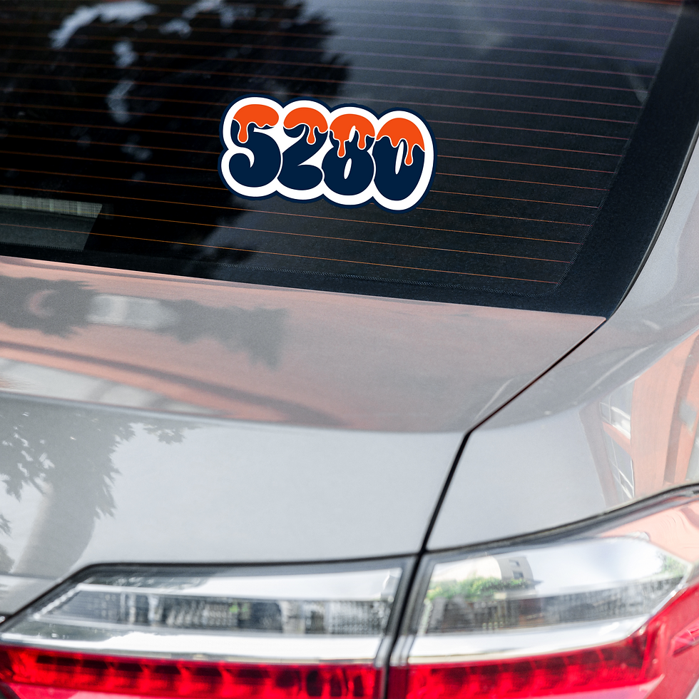 Thumbnail: Denver football-inspired "5280" sticker with orange and blue dripping design applied to the rear window of a car, with reflections of trees in the glass.